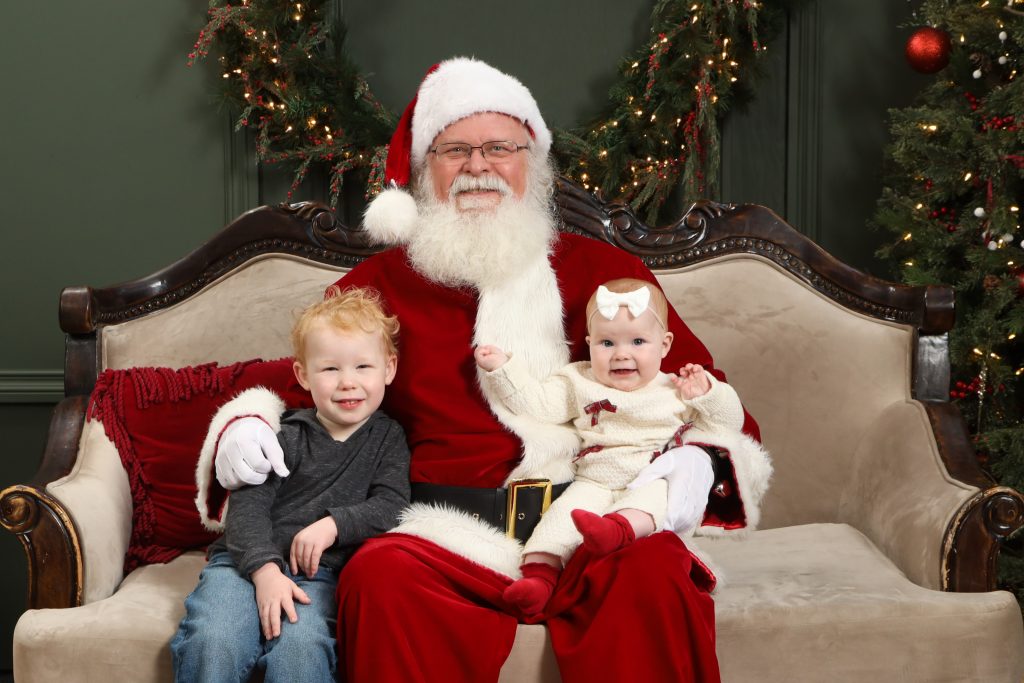 Santa Experience Photo With Two Kids